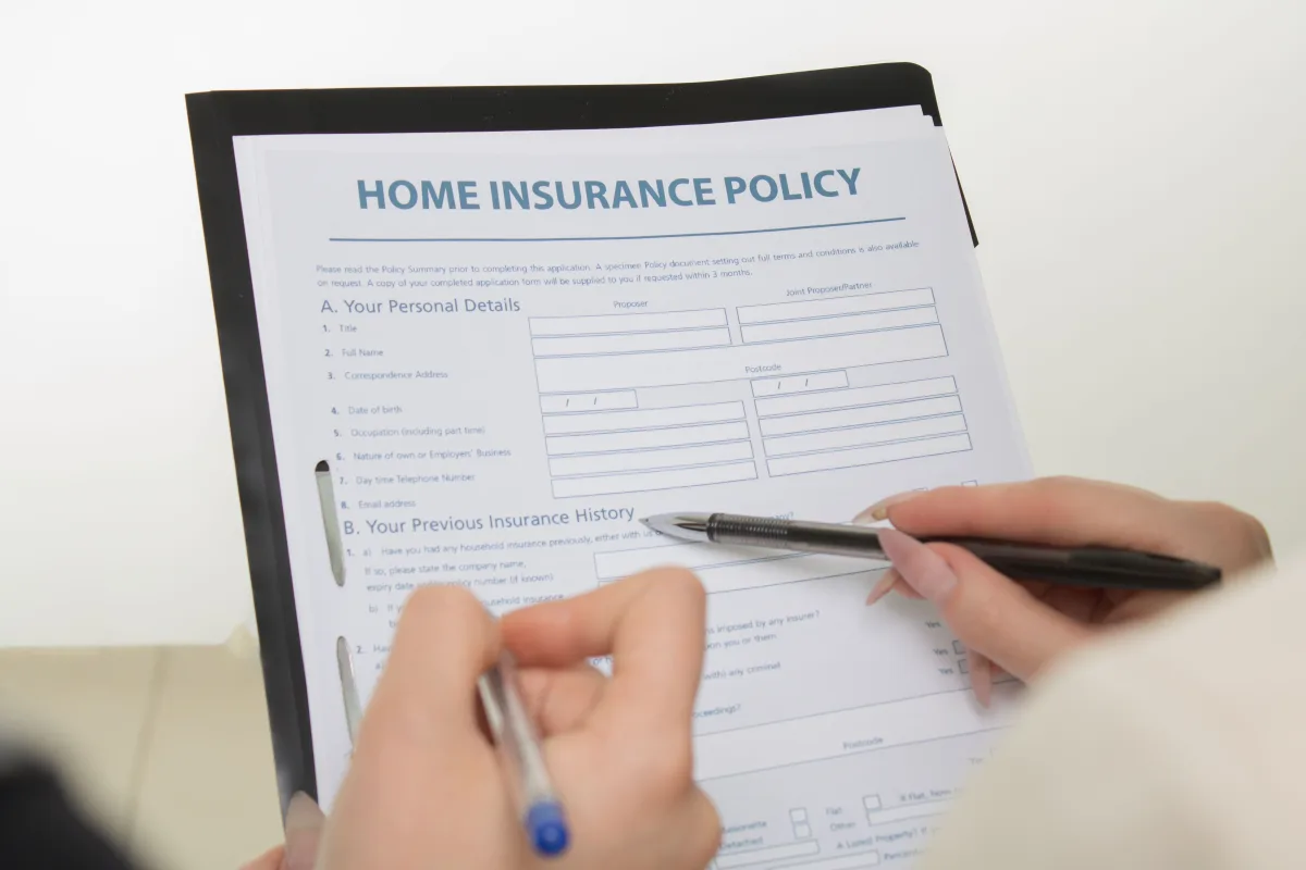 Home insurance policy documents with house model